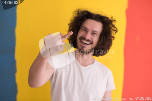 Image of young man with funny hair over color background