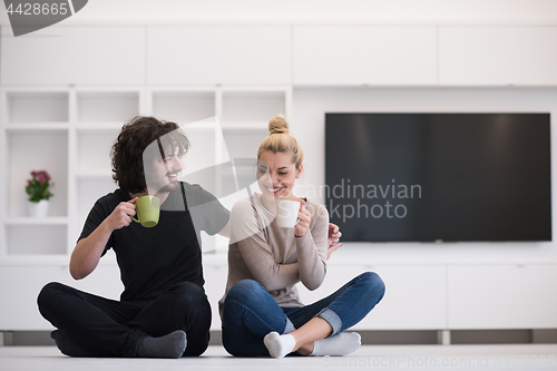 Image of young couple in their new home