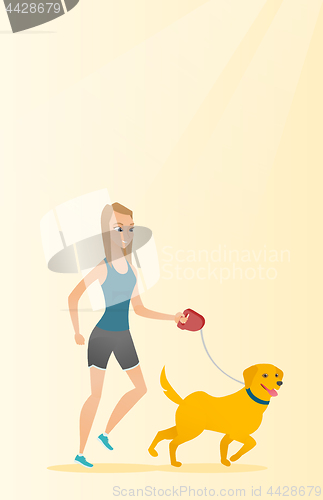 Image of Young woman walking with her dog.