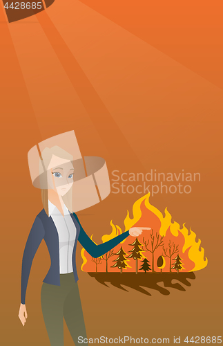 Image of Woman standing on background of wildfire.