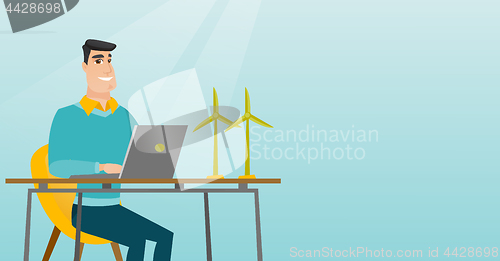 Image of Man working with model of wind turbines.