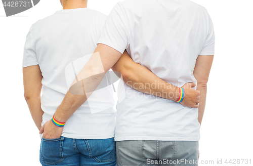 Image of male couple with gay pride rainbow wristbands