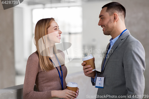 Image of businesswoman and businessman at coffee break