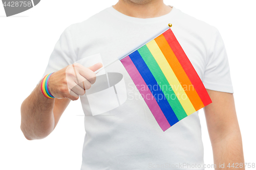 Image of man with gay pride rainbow flag and wristband