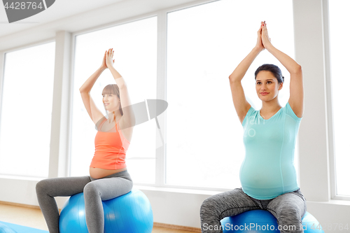 Image of pregnant women sitting on exercise balls in gym