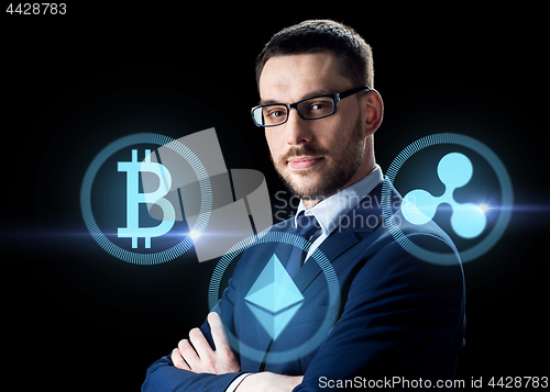 Image of buisnessman with cryptocurrency icons