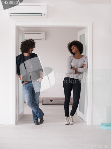 Image of multiethnic couple renovating their home