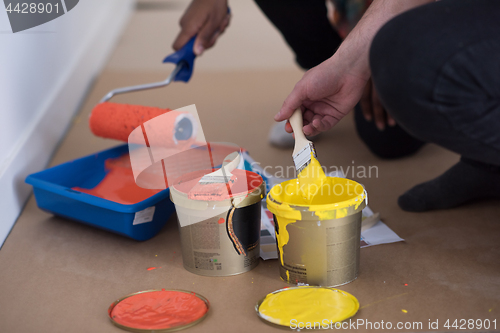 Image of painters prepare color for painting