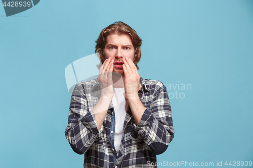 Image of Portrait of the scared man on pink