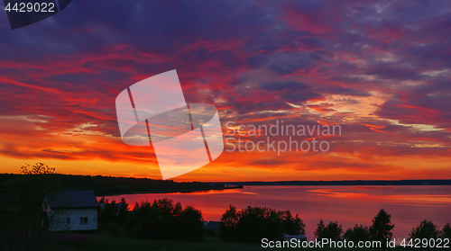 Image of Night Dramatic Burning Sunset Sky Over The Lake 