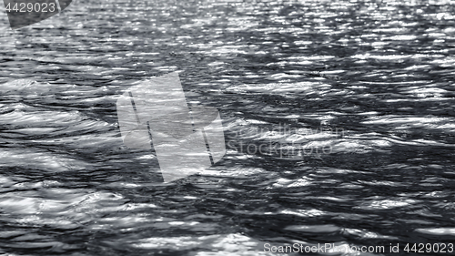Image of Dark Monochrome Silvery Flickering Ripples Of Water Surface