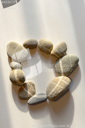 Image of pebble stones circle on white