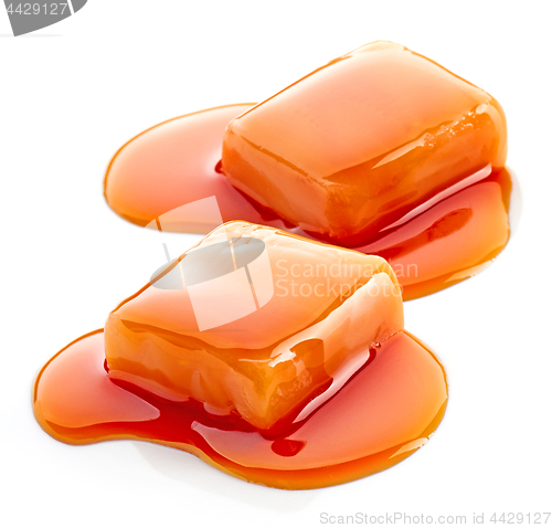 Image of two pieces of melted caramel candies