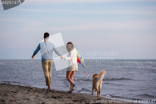 Image of happy couple enjoying time together at beach