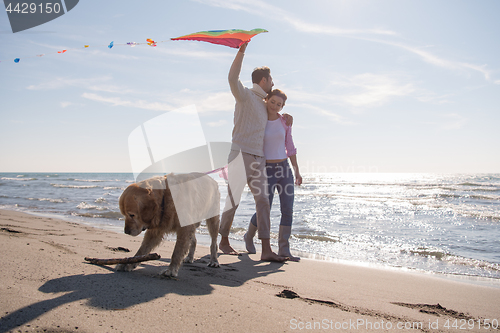 Image of happy couple enjoying time together at beach