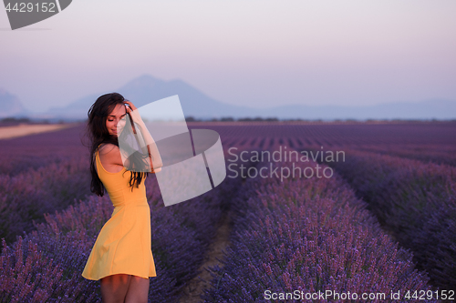 Image of woman in yellow dress at lavender field