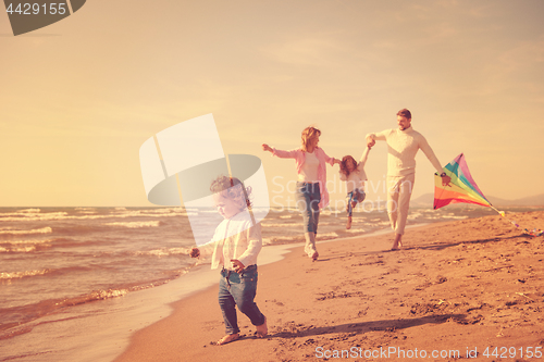 Image of happy family enjoying vecation during autumn day