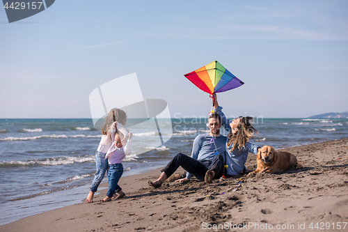 Image of happy young family enjoying vecation during autumn day