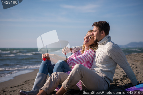 Image of young couple enjoying time together at beach