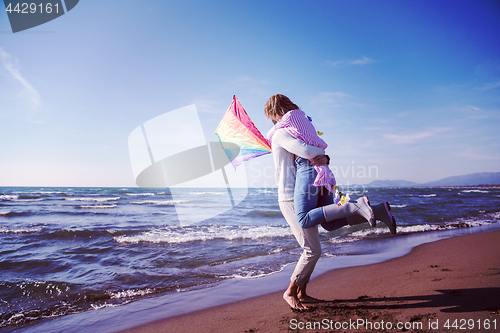 Image of Couple enjoying time together at beach