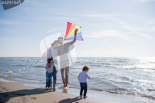 Image of happy family enjoying vecation during autumn day