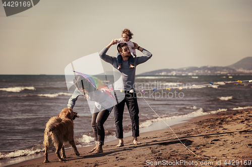 Image of happy young family enjoying vecation during autumn day