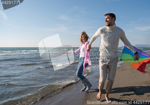 Image of Couple enjoying time together at beach