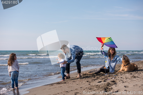 Image of happy young family enjoying vecation during autumn day