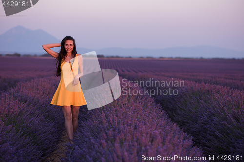 Image of woman in yellow dress at lavender field