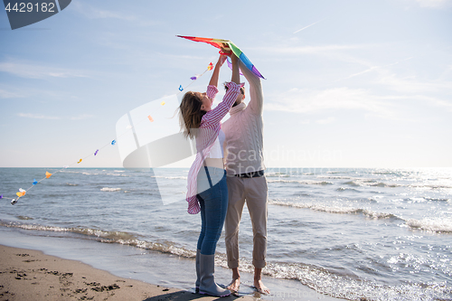 Image of Couple enjoying time together at beach