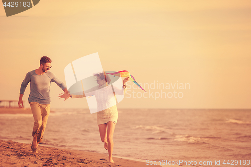 Image of Couple enjoying time together at beach