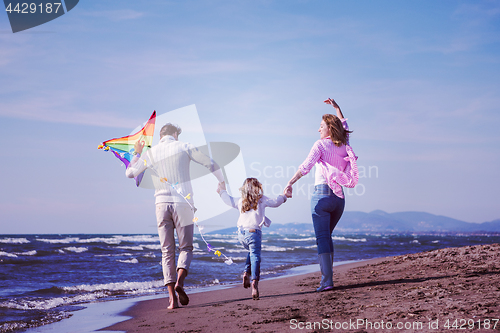 Image of happy family enjoying vecation during autumn day