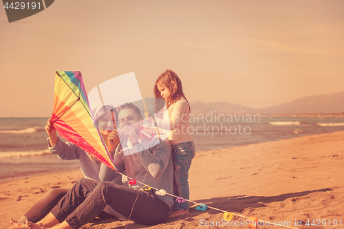 Image of happy family enjoying vecation during autumn day