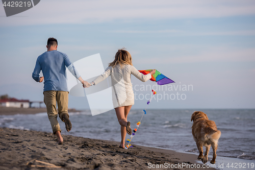 Image of happy couple enjoying time together at beach