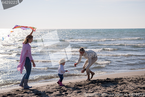 Image of happy family enjoying vecation during autumn day