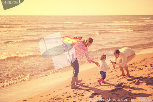 Image of happy family enjoying vecation during autumn day