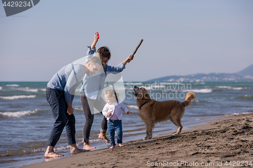 Image of happy young family enjoying vecation during autumn day