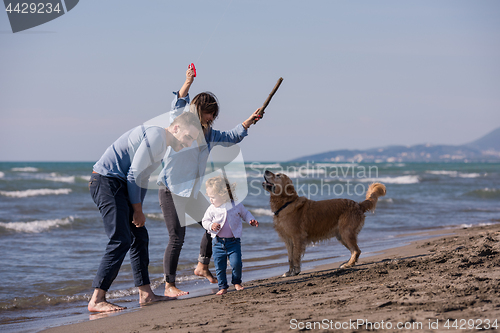 Image of happy young family enjoying vecation during autumn day