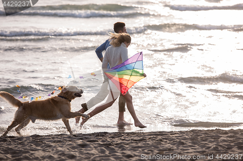 Image of happy couple enjoying time together at beach