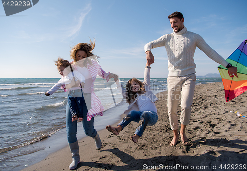 Image of happy family enjoying vecation during autumn day