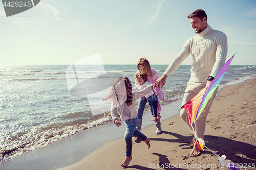 Image of happy family enjoying vecation during autumn day