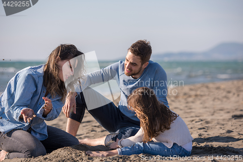 Image of Young family enjoying vecation during autumn