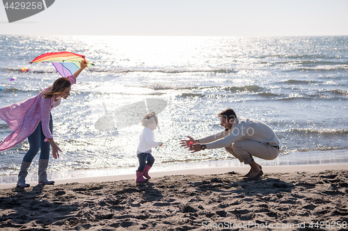 Image of happy family enjoying vecation during autumn day