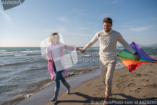 Image of Couple enjoying time together at beach