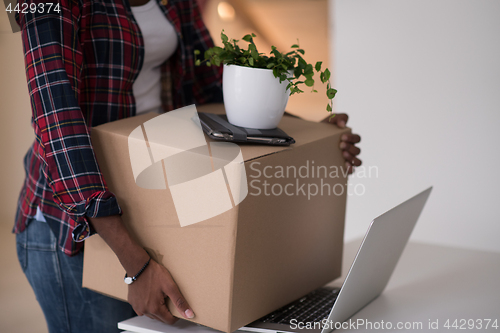 Image of Black girl moving in the new apartment