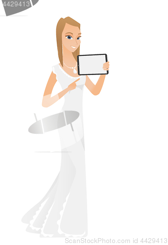Image of Smiling fiancee holding tablet computer.