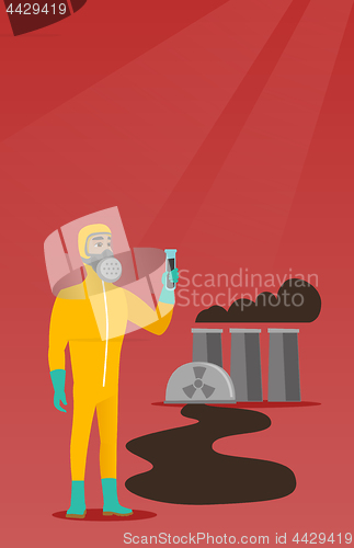 Image of Man in radiation protective suit with test tube.