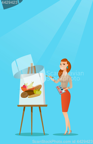 Image of Creative female artist painting portrait.