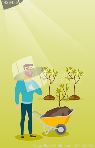 Image of Man pushing wheelbarrow with plant.