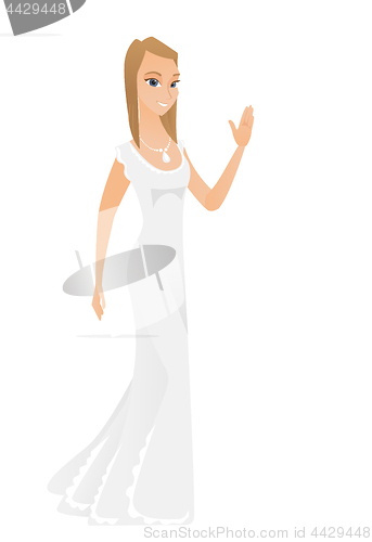 Image of Young caucasian bride waving her hand.
